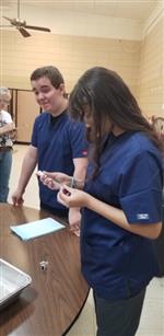 students assisting in "The Big Fix" 