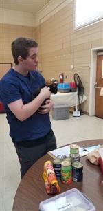 students assisting in "The Big Fix" 